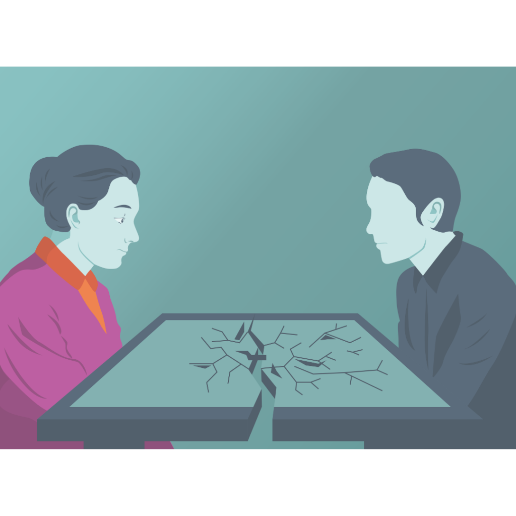 Zwei Personen sitzen sich an einem Tisch mit einer großen Rissbildung in der Mitte gegenüber